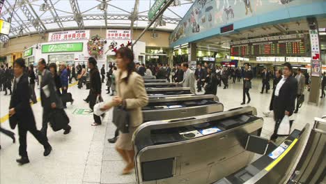Passengers-walk-through-JR-turnstiles-in-Ueno-Station-Tokyo-Japan
