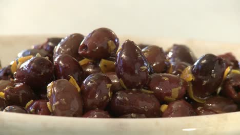 Horizontal-pan-of-olives-and-cheese-in-a-plate