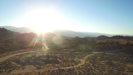 An-aerial-sunset-shot-over-the-Alabama-Hills-outside-Lone-Pine-California-with-Mt-Whitney-and-Sierras-background