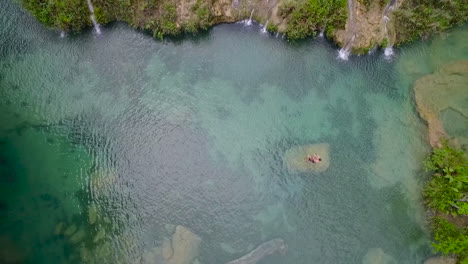 An-aerial-over-remarkable-waterfalls-and-green-polls-on-the-Semuc-Champey-river-in-Guatemala-1