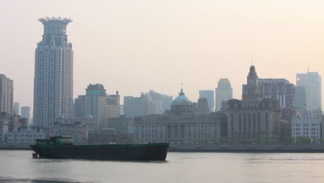 A-barge-travels-on-the-Pearl-River-in-Shanghai-China-in-smog-and-fog-3