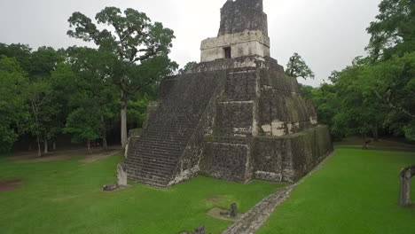 Great-aerial-shot-over-the-Tikal-pyramids-in-Guatemala-1