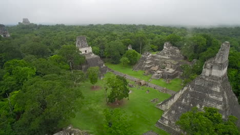 Great-aerial-shot-over-the-Tikal-pyramids-in-Guatemala-3