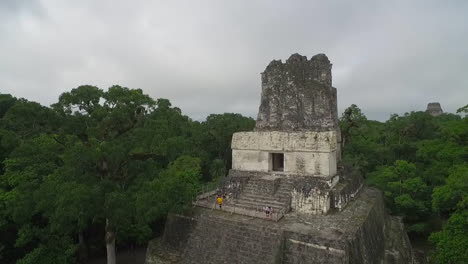 Great-aerial-shot-over-the-Tikal-pyramids-in-Guatemala-5
