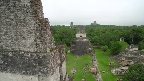 Great-aerial-shot-over-the-Tikal-pyramids-in-Guatemala-6
