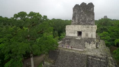 Great-aerial-shot-over-the-Tikal-pyramids-in-Guatemala-8