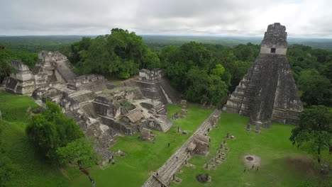 Great-aerial-shot-over-the-Tikal-pyramids-in-Guatemala-10