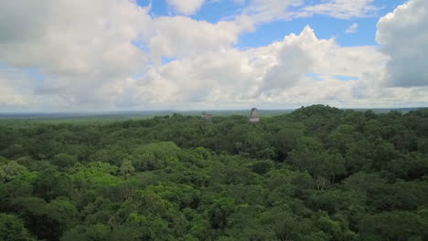 Spectacular-rising-aerial-shot-over-the-Tikal-pyramids-in-Guatemala-1