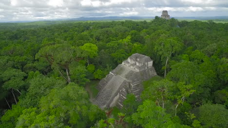 Spectacular-aerial-shot-over-the-Tikal-pyramids-in-Guatemala-3