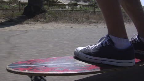A-skateboarder-maneuvers-his-way-along-a-seaside-sidewalk
