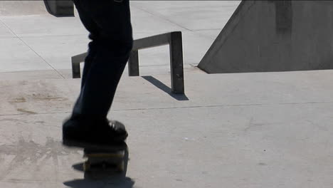 A-skateboarder-ollies-onto-a-rail-and-grinds-his-way-down