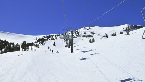 POV-of-someone--riding-up-a-ski-lift-in-the-mountains