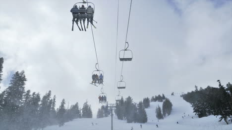 Timelapse-of-people-riding-up-a-ski-lift-in-the-mountains