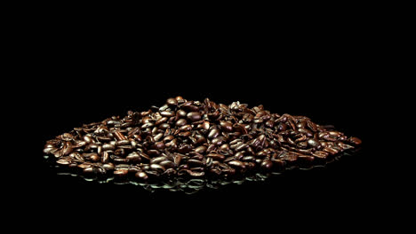 A-distant-shot-of-a-pile-of-roasted-coffee-beans-slowly-rotating