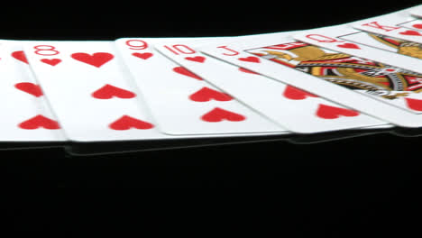 A-deck-of-cards-laid-out-rotates-in-front-of-a-camera