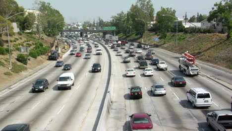 Heavy-traffic-moves-in-opposite-directions-along-a-four-lane-freeway-in-Los-Angeles
