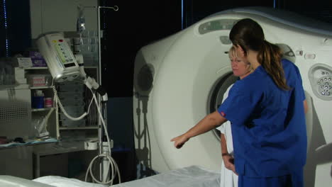 A-doctor-prepares-a-patient-for-a-CAT-scan-5