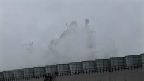 Smoke-rises-from-stacks-at-a-power-facility