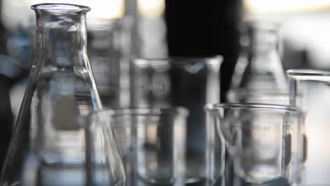 Scientific-glass-beakers-coming-into-focus