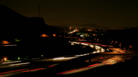 Vehicles-drive-on-a-freeway-at-night-in-fast-motion-1