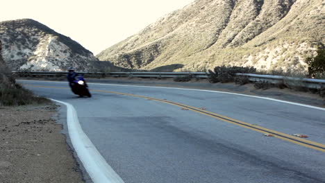 Motorcycle-and-cars-on-winding-montaña-road-2