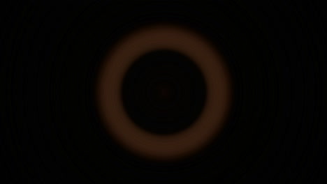 Leuchtend-Orangefarbene-Kreise-Blinken-Und-Verschwinden-Vor-Einem-Schwarzen-Hintergrund