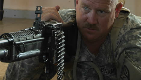 A-man-prepares-to-fire-an-automatic-weapon