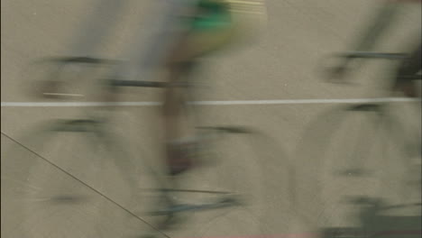 Bicycle-riders-pass-by-in-a-blur