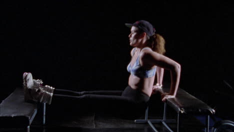 A-woman-doing-triceps-dips-on-a-bench