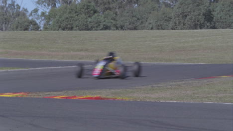 Formula-cars-racing-on-a-circuit-track-1