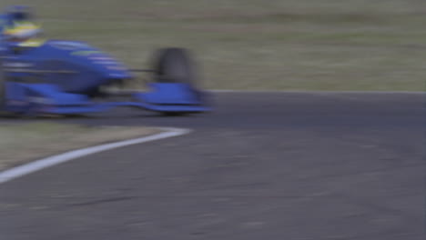 A-race-car-speeds-between-two-turns-on-a-track