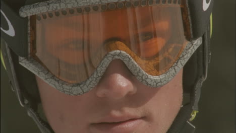 A-child-looks-through-goggles-in-a-ski-helmet