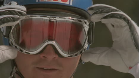 A-skier-adjusts-his-goggles