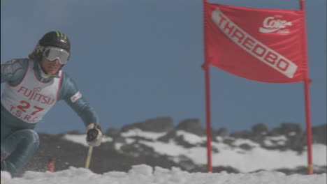 A-skier-skis-around-a-sign-and-continues-downhill