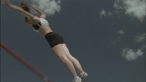 A-girl-performs-a-pole-vault-knocking-down-the-bar