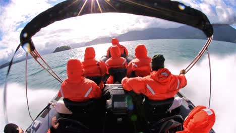 Point-of-view-wide-angle-of-passengers-on-a-bouncy-zodiac-ride-moving-fast-across-the-water--in-Southern-Chile