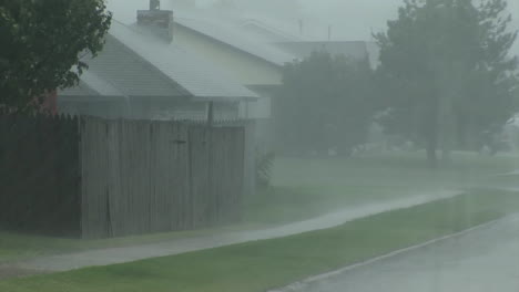 A-Torrential-Rainstorm-Falls-In-A-Suburban-Neighborhood