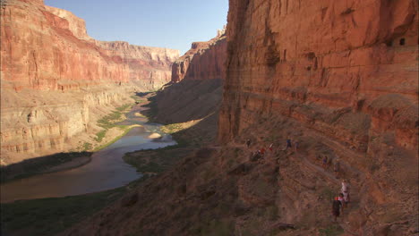 Hikers-On-A-Narrow-Trail-Along-A-Cliff-In-The-Grand-Canyon-1