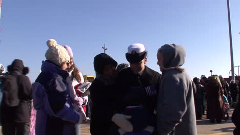 Navy-Families-Welcome-Home-Servicemen-From-An-Aircraft-Carrier-2