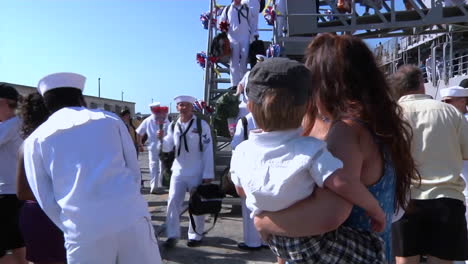 Navy-Families-Welcome-Home-Servicemen-From-An-Aircraft-Carrier-4