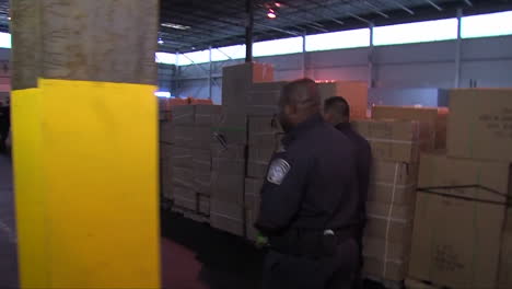 Homeland-Security-Agents-Search-Through-A-Shipping-Facility-For-Lead-In-Toys-2