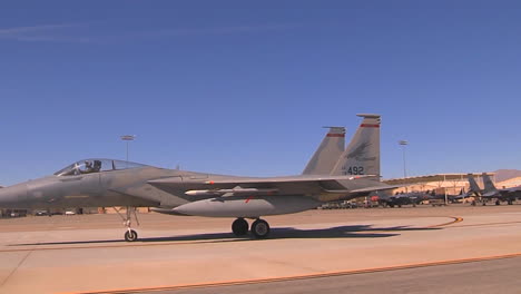 F15-And-F16-Fighter-Jets-Line-Up-And-Taxi-For-Takeoff-In-A-Military-Exercise-2