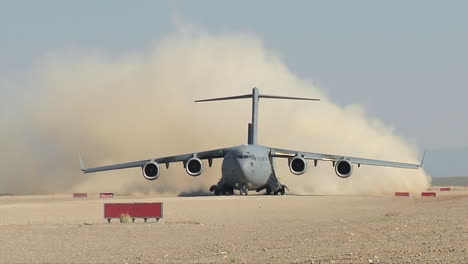 A-C130-Cargo-Plane-Takes-Off-From-A-Dirt-Runway-In-The-Desert-2