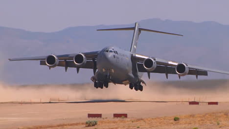 A-C130-Cargo-Plane-Lands-On-A-Dirt-Runway-In-The-Desert-1