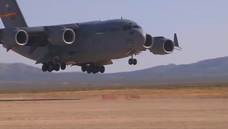 A-C130-Cargo-Plane-Lands-On-A-Dirt-Runway-In-The-Desert-3