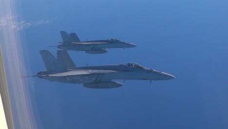 Pov-Out-Of-The-Window-Of-A-Plane-With-Fighter-Jets-Outside-1