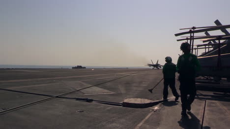 Various-Jet-Aircraft-Land-On-The-Deck-Of-An-Aircraft-Carrier