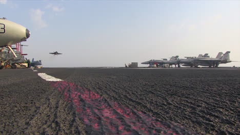 Various-Jet-Aircraft-Land-On-The-Deck-Of-An-Aircraft-Carrier-3