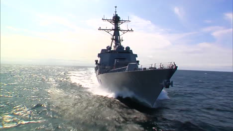 Very-Good-Aerial-Across-The-Bow-Of-A-Navy-Warship-At-Sea