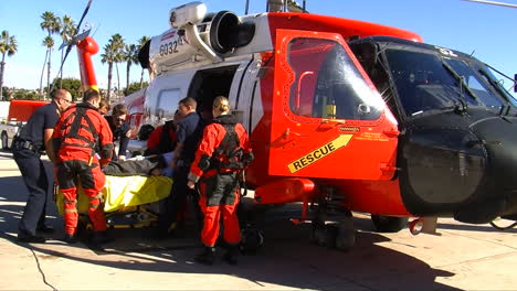 Coast-Guard-Helicopter-Lands-At-Landing-Site-And-Injured-People-Are-Taken-By-Paramedics-To-Hospital-3